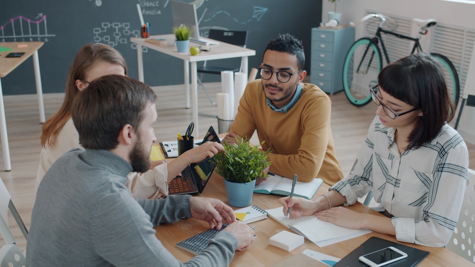 Diverse team collaborating together at a table